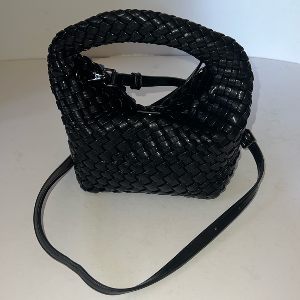 Woven mini bag with small zip case, snap closure. PU vegan “leather”.